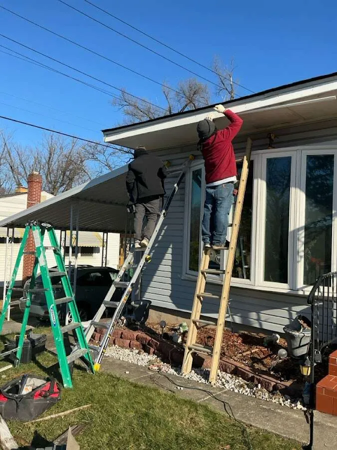 Restoration crew performing exterior repair in O'Fallon